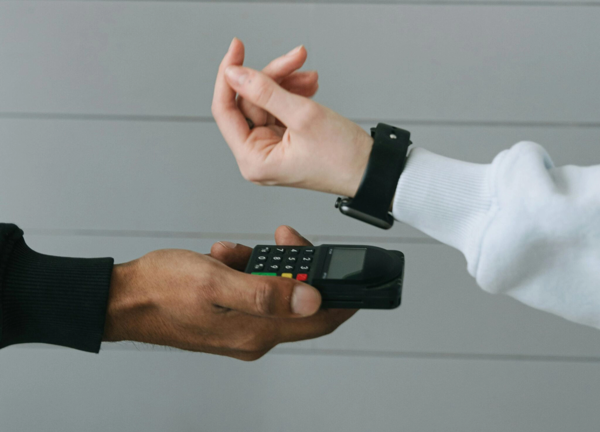 Person in White Long Sleeve Shirt Wearing Smartwatch