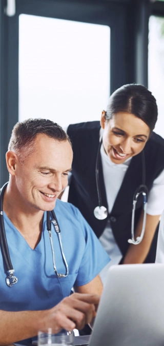 Doctors using technology to streamline payments with secure payment processing solutions.