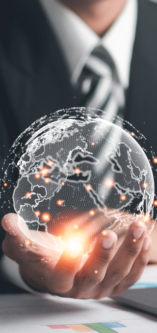 Businessperson holding a glowing digital globe, representing global payment processing solutions.