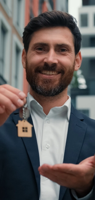 A professional handing over house keys, symbolizing secure payment processing solutions.
